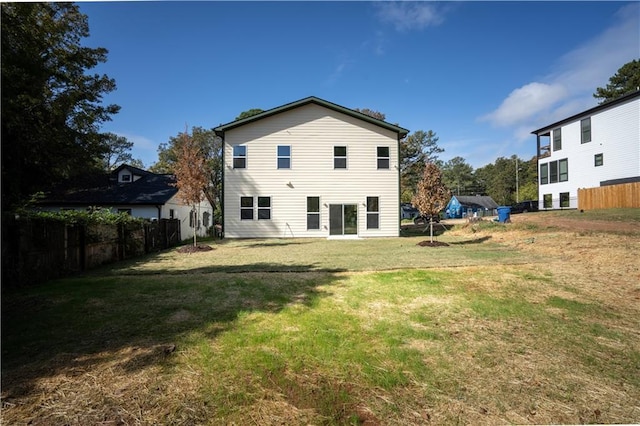 back of house with a yard