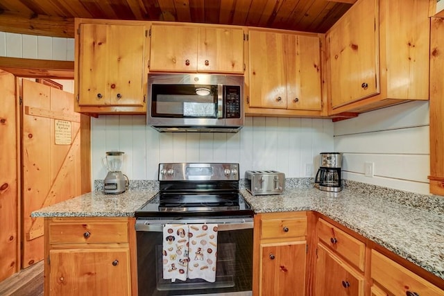 369 Trillium Rd, Suches, GA 30572 - kitchen with stainless steel appliances, wooden ceiling, and light stone counters