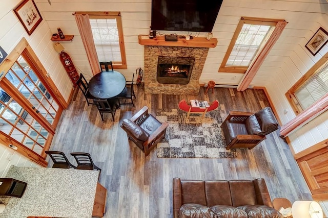 369 Trillium Rd, Suches, GA 30572 - living room with wood finished floors, a fireplace, and wooden walls