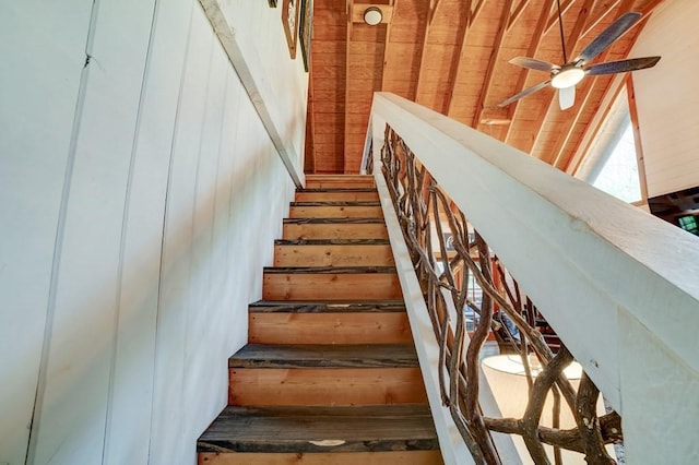369 Trillium Rd, Suches, GA 30572 - staircase featuring a ceiling fan and wood walls