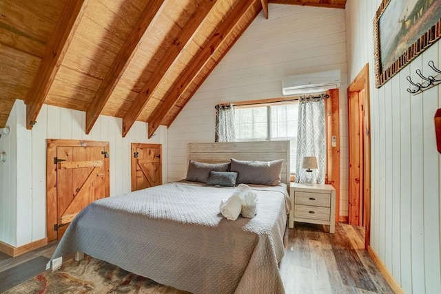369 Trillium Rd, Suches, GA 30572 - bedroom with a wall unit AC, wood finished floors, wood walls, wooden ceiling, and baseboards
