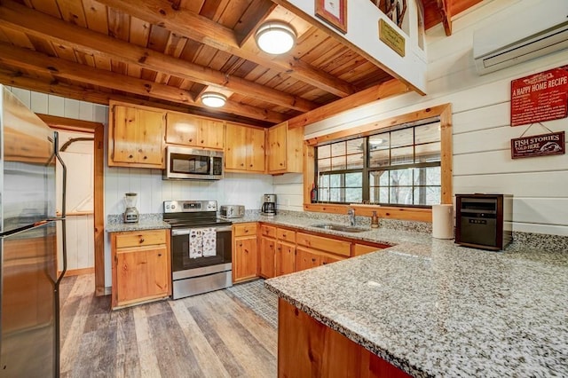 369 Trillium Rd, Suches, GA 30572 - kitchen featuring stainless steel appliances, wood ceiling with exposed beams, a wall mounted AC, light wood finished floors, and a sink