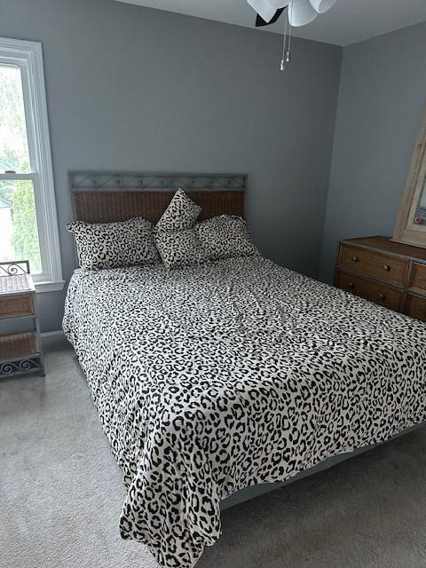 280 Ridge Bluff Ln, Suwanee, GA 30024 - bedroom with carpet floors and ceiling fan