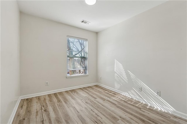 unfurnished room with light hardwood / wood-style flooring