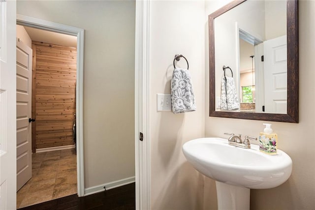 bathroom with baseboards and a sink