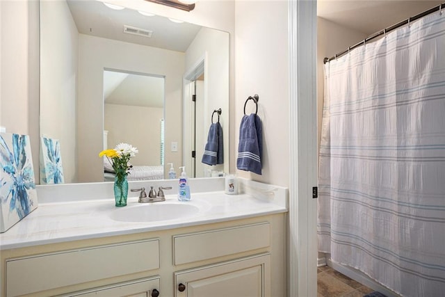 full bathroom featuring vanity and curtained shower
