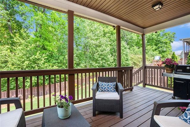 deck with fence and grilling area