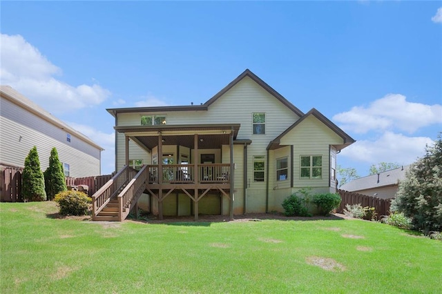 back of house featuring a deck and stairs