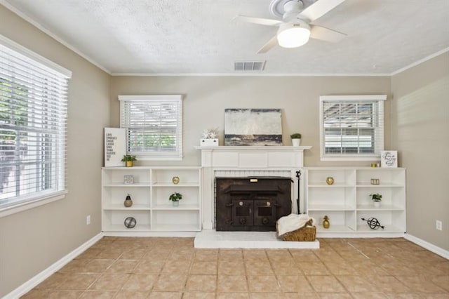 unfurnished living room with a textured ceiling, light tile patterned flooring, ceiling fan, and crown molding