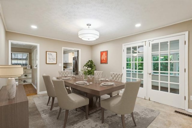 dining room with a textured ceiling