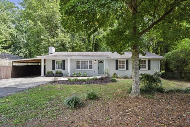 single story home featuring a carport