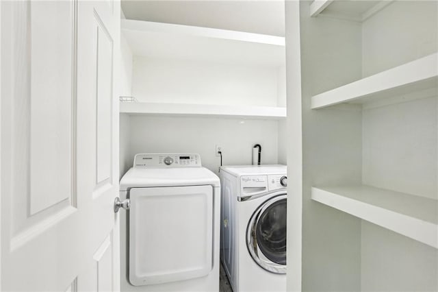 laundry area featuring washing machine and dryer and laundry area