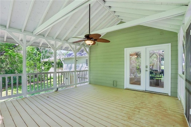 unfurnished sunroom with beamed ceiling, french doors, and a ceiling fan
