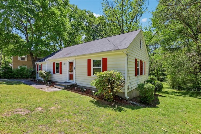 ranch-style home with a front lawn