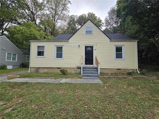 bungalow-style home with a front yard and crawl space