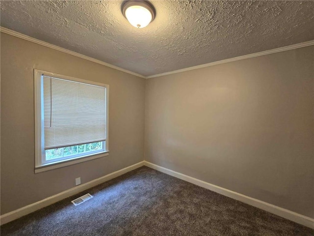 empty room featuring baseboards, dark colored carpet, and ornamental molding