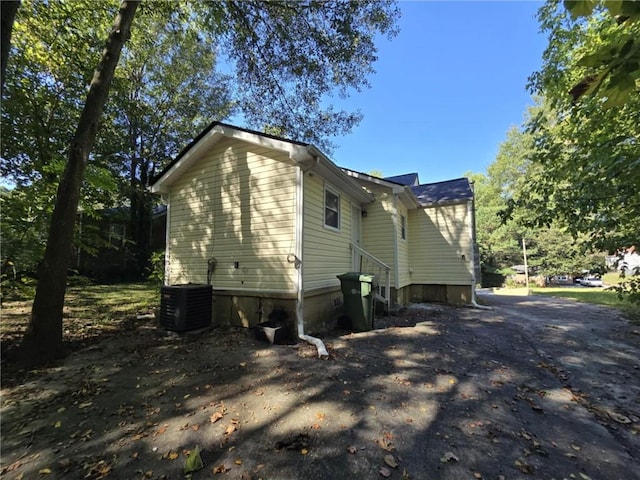 view of side of home with cooling unit