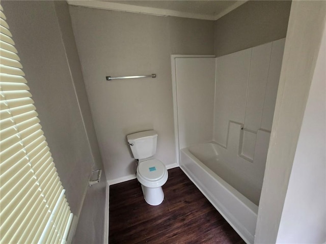 full bath with baseboards, toilet, and wood finished floors