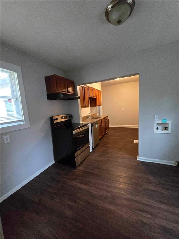 kitchen featuring sink, dark hardwood / wood-style floors, and appliances with stainless steel finishes