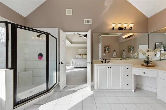 bathroom with vanity, vaulted ceiling, tile patterned floors, and ceiling fan