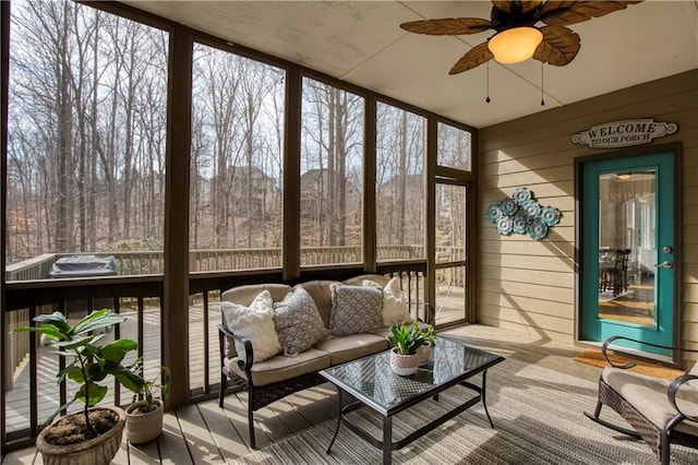 sunroom with ceiling fan