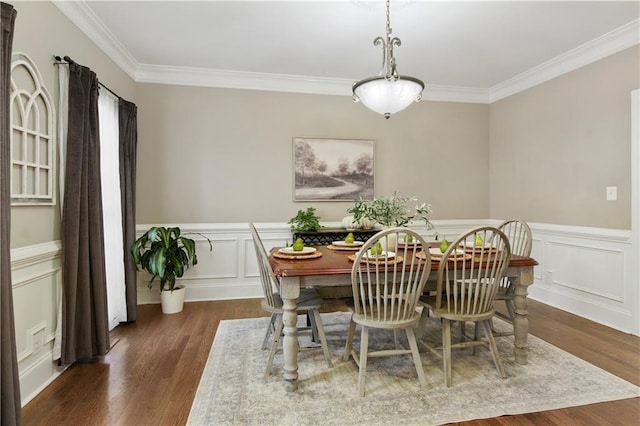 dining area with crown molding and dark hardwood / wood-style floors