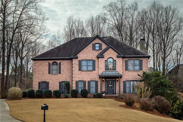 view of front of home with a front lawn