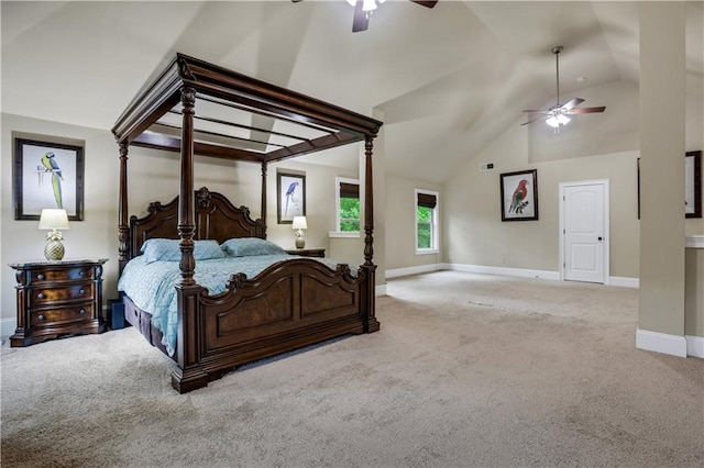 carpeted bedroom with ceiling fan and vaulted ceiling