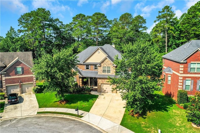 craftsman-style home featuring a garage and a front yard