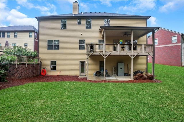 back of house with a patio, a yard, and ceiling fan