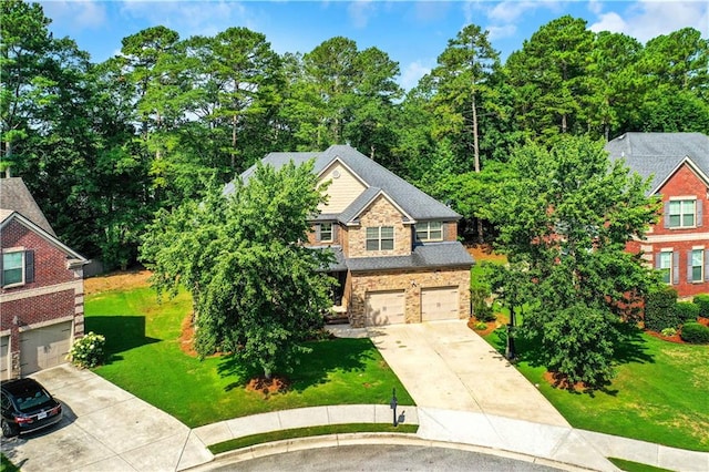 view of front of home with a garage and a front yard