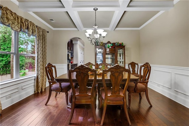 dining room featuring dark hardwood / wood-style flooring, beam ceiling, a chandelier, and plenty of natural light