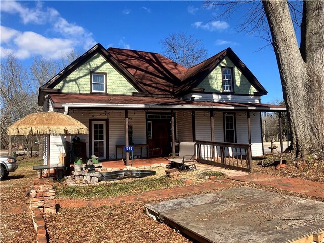 view of front of home with a patio area and a porch