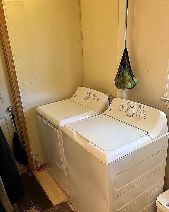 laundry area with separate washer and dryer