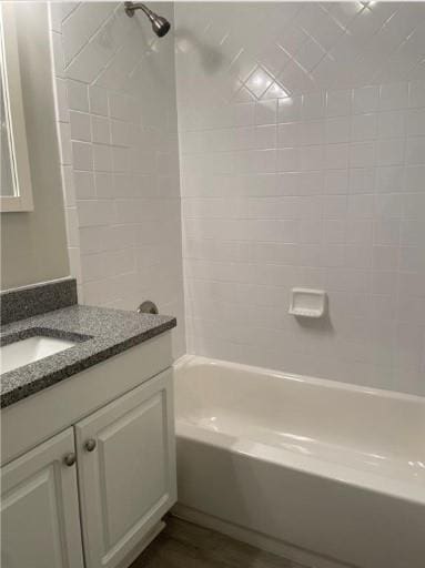 bathroom with tiled shower / bath and oversized vanity