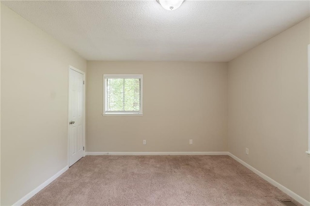 4669 Birch Ridge Trl, Stone Mountain, GA 30083 - spare room with light carpet, baseboards, and a textured ceiling