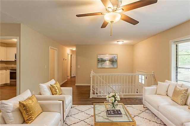 4669 Birch Ridge Trl, Stone Mountain, GA 30083 - living room with wood finished floors, a ceiling fan, and baseboards