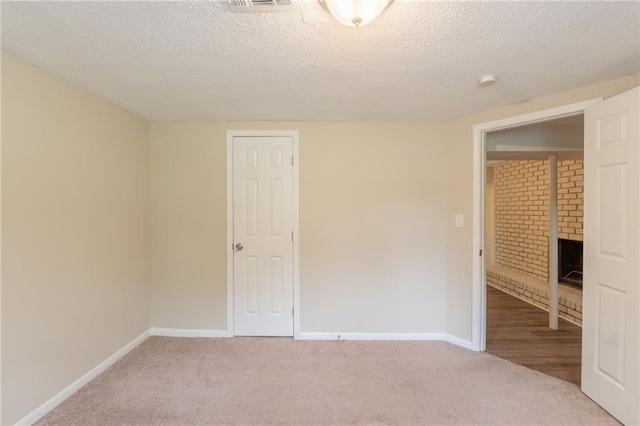 4669 Birch Ridge Trl, Stone Mountain, GA 30083 - carpeted empty room featuring baseboards and a textured ceiling