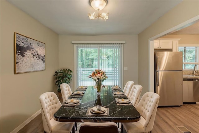 4669 Birch Ridge Trl, Stone Mountain, GA 30083 - dining space with light wood-type flooring and baseboards