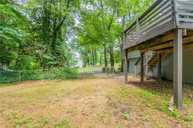 4669 Birch Ridge Trl, Stone Mountain, GA 30083 - view of yard with stairway, a wooden deck, and an attached garage