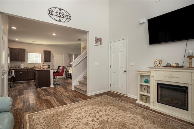 living room with dark hardwood / wood-style floors