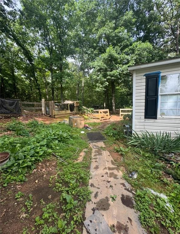 60B Corson Trl, Taylorsville, GA 30178 - view of yard with a garden and view of wooded area