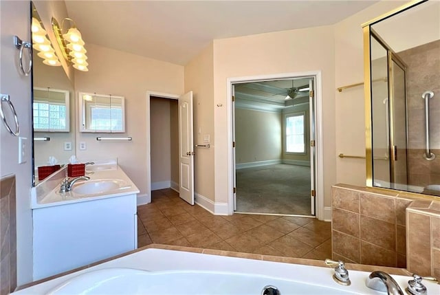 bathroom featuring a sink, a stall shower, a bath, and tile patterned floors