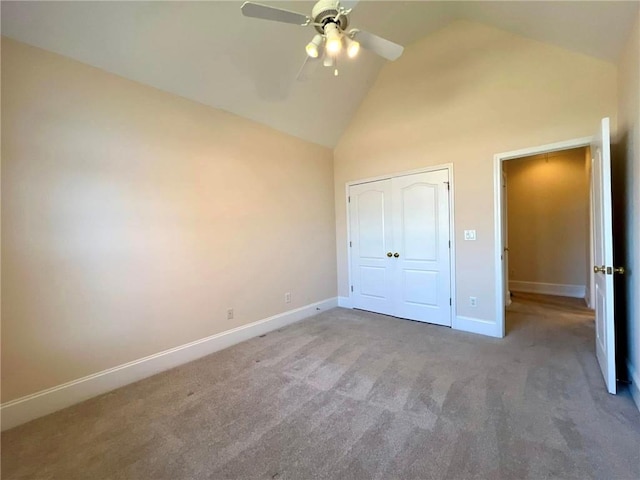 unfurnished bedroom featuring high vaulted ceiling, carpet, baseboards, and ceiling fan