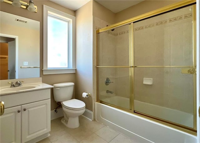 bathroom with baseboards, visible vents, toilet, combined bath / shower with glass door, and vanity