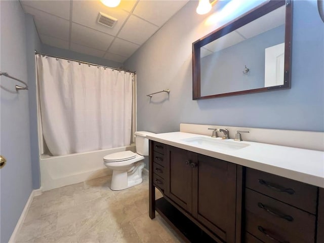 bathroom with toilet, a paneled ceiling, vanity, visible vents, and shower / bathtub combination with curtain