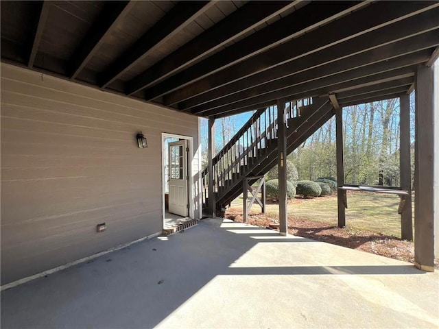 view of patio / terrace featuring stairway