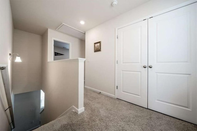 corridor featuring attic access, recessed lighting, an upstairs landing, baseboards, and carpet floors