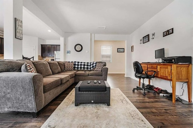living area with baseboards and dark wood-style flooring