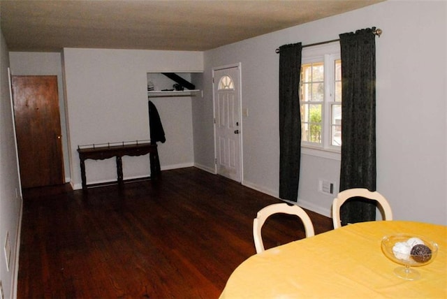 dining room with dark hardwood / wood-style flooring